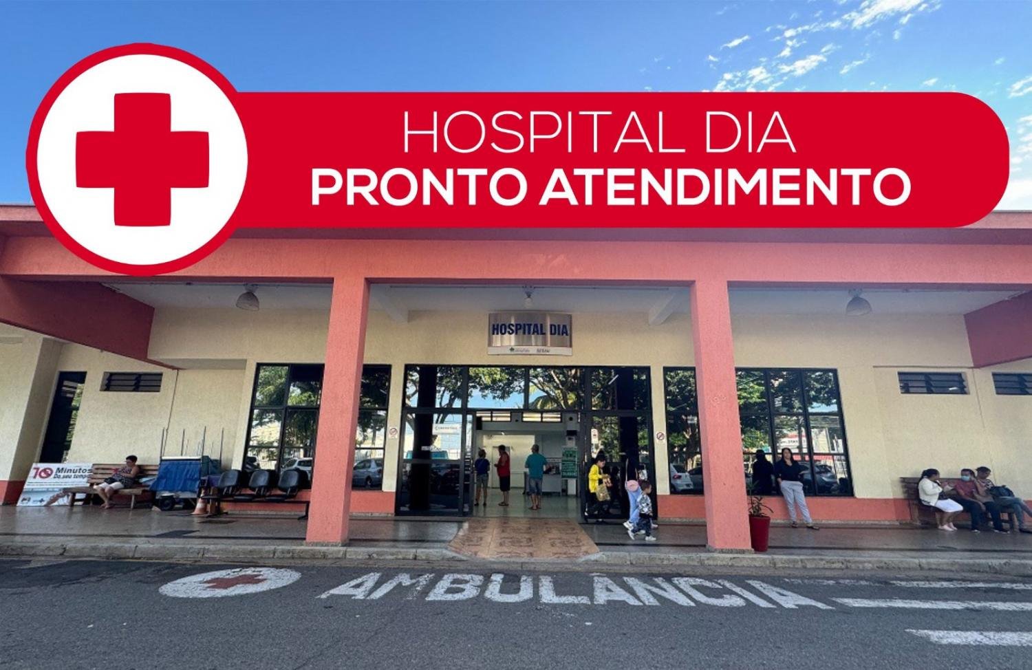 A imagem mostra a fachada do Hospital Dia, nas cores amarelo e terracota, com vidros espelhados. Acima tem a imagem de uma cruz com fundo vermelho escrito Pronto Atendimento em branco.